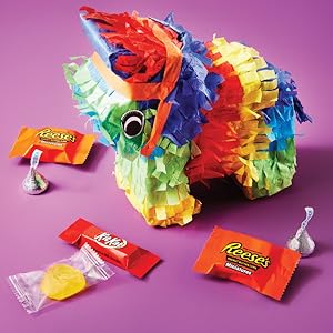 Hershey's Kisses candies, Kit Kat Miniatures bars and Reese's Miniatures cups around a pinata