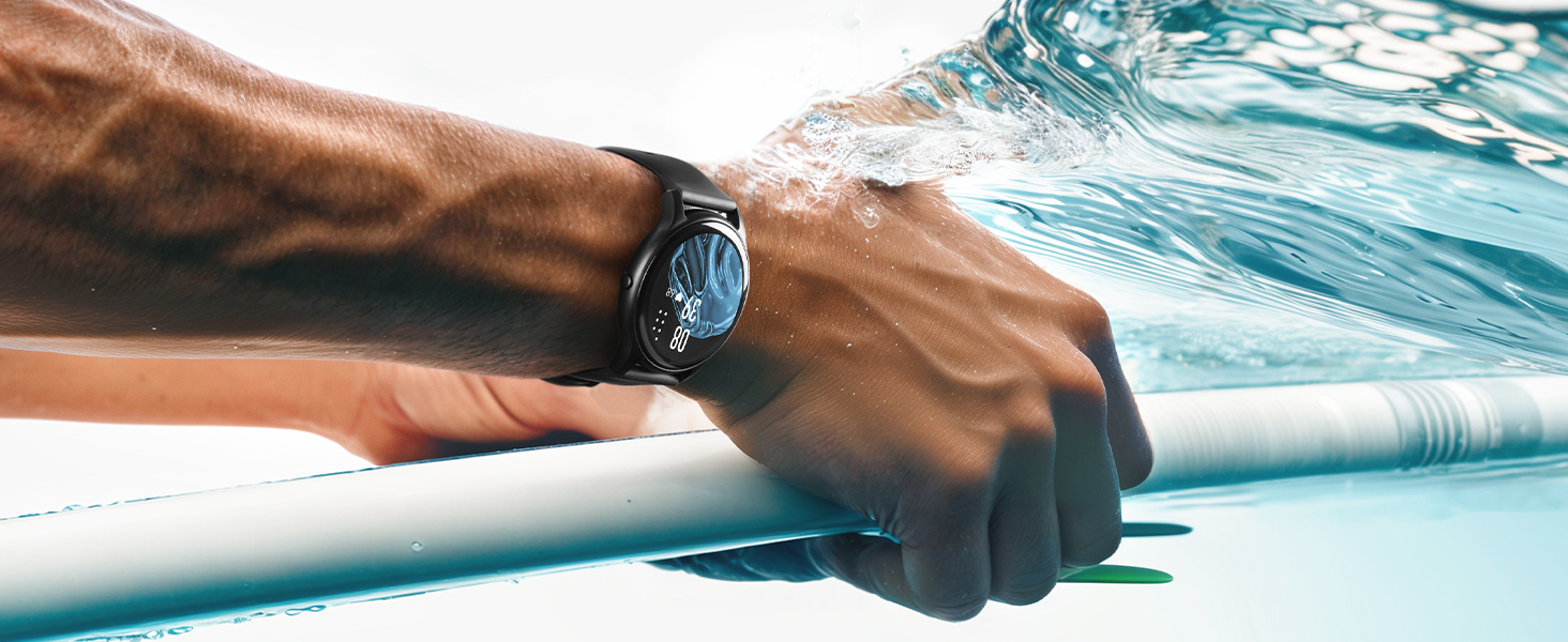 Close-up of hands holding or adjusting surfboard with blue water visible in background.